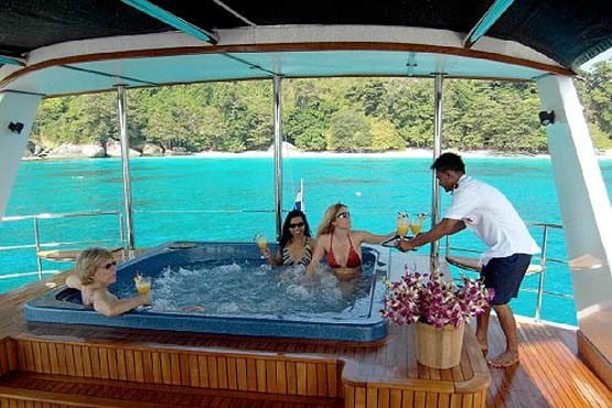 Luxury Sailing & Motor Catamaran drinks served in the top deck jacuzzi