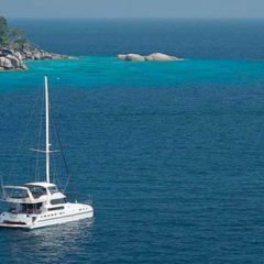 Luxury Sailing & Motor Catamaran close to shore in Phuket