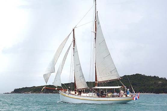 Classic Schooner Sailing Yacht racing along the coast